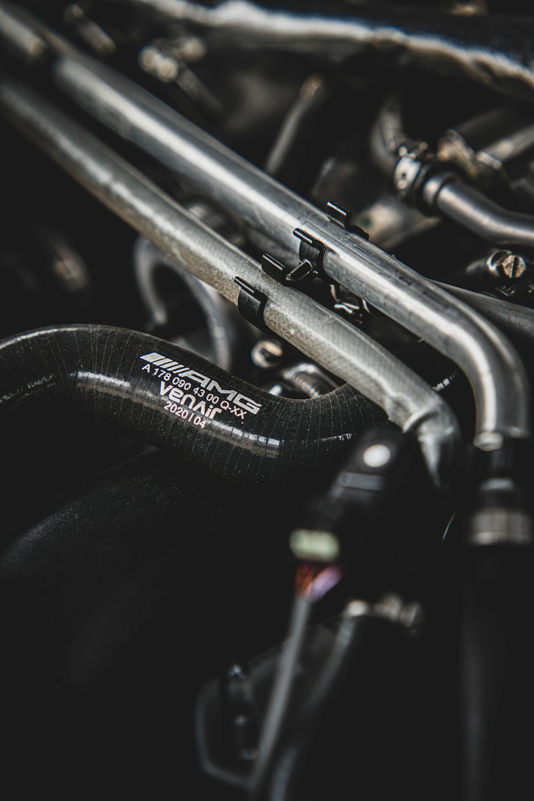 close-up-of-amg-engine-hoses-and-metal-pipes-w9htzufgkp0